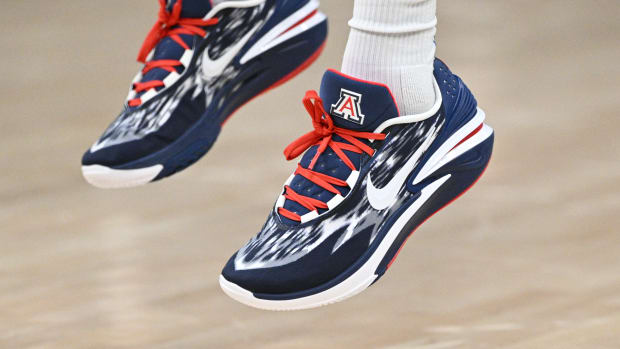 View of navy, white, and red Nike shoes.